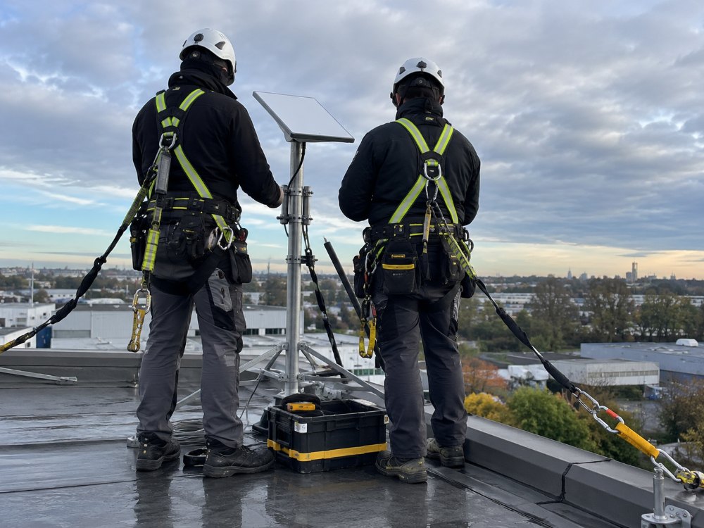 Antenna and access-point installation from a mobile elevated platform, with a second worker as ground supervisor